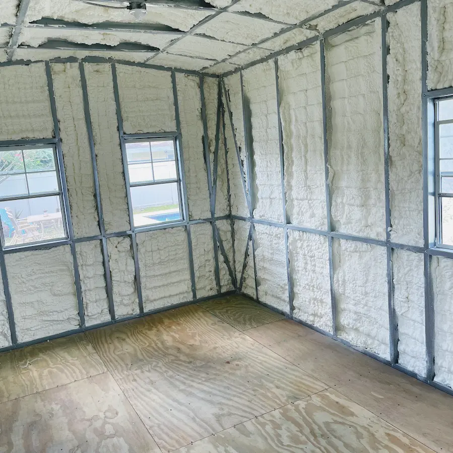 Closed-cell spray foam insulation applied to wall cavities in a residential project in Chickasha